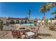 Beautiful backyard with a pool, fire pit, and desert landscape at 3788 Forestcrest Dr, Las Vegas, NV 89121
