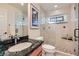 Modern bathroom with glass-enclosed shower, stylish vanity, and elegant fixtures at 3788 Forestcrest Dr, Las Vegas, NV 89121