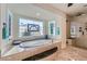 Bright bathroom featuring a soaking tub, walk-in shower, and decorative stained glass windows at 3788 Forestcrest Dr, Las Vegas, NV 89121