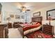 Comfortable bedroom featuring a ceiling fan, stylish decor, and a warm, inviting ambiance at 3788 Forestcrest Dr, Las Vegas, NV 89121