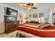 Comfortable bedroom featuring a ceiling fan, stylish decor, and a warm, inviting ambiance at 3788 Forestcrest Dr, Las Vegas, NV 89121