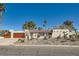 Charming single-story home with desert landscaping, a red tile roof and an attached two-car garage at 3788 Forestcrest Dr, Las Vegas, NV 89121