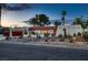 Charming single story home with a red tile roof, desert landscaping and red garage door at 3788 Forestcrest Dr, Las Vegas, NV 89121