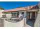 Inviting front entrance featuring a terra cotta roof, a seating area, and a decorative glass door at 3788 Forestcrest Dr, Las Vegas, NV 89121