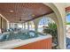 Relaxing hot tub on a covered patio overlooking the backyard at 3788 Forestcrest Dr, Las Vegas, NV 89121