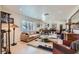 Spacious living room with elegant furnishings, neutral colors, and a view of the dining area at 3788 Forestcrest Dr, Las Vegas, NV 89121