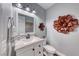 Half bathroom featuring decor wall art and toilet at 3809 Vincelli Ave, North Las Vegas, NV 89031