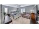 Comfortable bedroom with a queen bed, lounge sofa, desk and plush carpeting at 3809 Vincelli Ave, North Las Vegas, NV 89031