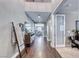 Inviting entryway featuring hardwood floors and an open floor plan with views of dining area at 3809 Vincelli Ave, North Las Vegas, NV 89031