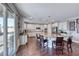 Gourmet kitchen with granite counters, white cabinetry, stainless appliances, and open floor plan at 3809 Vincelli Ave, North Las Vegas, NV 89031