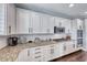 Gourmet kitchen featuring granite counters, white cabinets, stainless steel appliances, and subway tile backsplash at 3809 Vincelli Ave, North Las Vegas, NV 89031