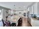 Gourmet kitchen with granite counters, white cabinets, stainless appliances, open floor plan and seating at 3809 Vincelli Ave, North Las Vegas, NV 89031