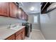 The laundry room has washer and dryer units with ample cabinets and counter space at 3809 Vincelli Ave, North Las Vegas, NV 89031