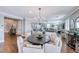 Spacious living area with modern furnishings, wood floors, plantation shutters, and open plan layout at 3809 Vincelli Ave, North Las Vegas, NV 89031