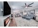 Open-concept living room flowing into dining area, features fireplace and modern decor at 3809 Vincelli Ave, North Las Vegas, NV 89031