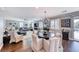 Spacious living area with modern furnishings, wood floors, plantation shutters, and open plan layout at 3809 Vincelli Ave, North Las Vegas, NV 89031