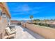 Large outdoor patio with lounge seating and views of the neighborhood and blue skies at 3809 Vincelli Ave, North Las Vegas, NV 89031