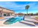 Beautiful backyard featuring a custom pool and spa with an outdoor seating area, perfect for relaxing and entertaining at 3809 Vincelli Ave, North Las Vegas, NV 89031
