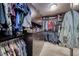 Custom walk-in closet with ample storage, built-in shelving, drawers, and hanging rods at 3809 Vincelli Ave, North Las Vegas, NV 89031