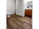 Bathroom featuring wood-look flooring, a shower, vanity, and a toilet at 3829 Soda Springs Dr, Las Vegas, NV 89115