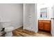 Bathroom featuring wood-look flooring, a shower, vanity, and a toilet at 3829 Soda Springs Dr, Las Vegas, NV 89115