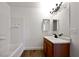 A bathroom featuring a shower-tub combo and a wood vanity with a white sink at 3829 Soda Springs Dr, Las Vegas, NV 89115