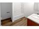 A bathroom featuring a shower-tub combo and a wood vanity with a white sink at 3829 Soda Springs Dr, Las Vegas, NV 89115
