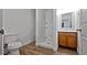 Modern bathroom with a walk-in shower, new flooring, updated vanity, and neutral colors at 3829 Soda Springs Dr, Las Vegas, NV 89115