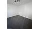A minimal bedroom with gray carpet and white walls offers a simple design at 3829 Soda Springs Dr, Las Vegas, NV 89115