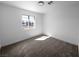 Clean, blank bedroom with new carpet, freshly painted walls, and a window for natural light at 3829 Soda Springs Dr, Las Vegas, NV 89115