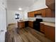 Features wood-look flooring, stainless steel appliances, and wood cabinets at 3829 Soda Springs Dr, Las Vegas, NV 89115