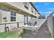 Small backyard with a patio and table set, enclosed by a cinderblock wall, partially graveled at 3920 Sweet Pine St # 102, Las Vegas, NV 89108