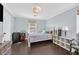 Cozy bedroom with a queen bed, wood floors, and ample space at 3920 Sweet Pine St # 102, Las Vegas, NV 89108