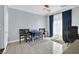 Bright dining area with stylish chandelier, blue accent curtains and tile flooring at 3920 Sweet Pine St # 102, Las Vegas, NV 89108