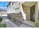 Charming home featuring a landscaped entrance with a dark front door at 3920 Sweet Pine St # 102, Las Vegas, NV 89108