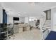 Open-concept living area with tile flooring, stairs to the second floor and dining area at 3920 Sweet Pine St # 102, Las Vegas, NV 89108