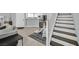 Inviting living area features tile flooring, light gray walls, and stairs to the second floor at 3920 Sweet Pine St # 102, Las Vegas, NV 89108