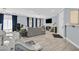 Comfortable living room with tile floors, ample natural light, and blue accent curtains at 3920 Sweet Pine St # 102, Las Vegas, NV 89108