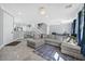 Spacious living room with tile floors, stairs to the second floor, and neutral-colored walls at 3920 Sweet Pine St # 102, Las Vegas, NV 89108