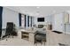 Bright living room with tile flooring, blue curtains, and a comfortable seating area at 3920 Sweet Pine St # 102, Las Vegas, NV 89108