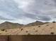 Backyard view of desert mountainscape and block wall for privacy at 4243 Sago Lily St, Las Vegas, NV 89129