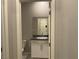 Well-lit bathroom featuring a vanity with granite countertop and modern fixtures at 4243 Sago Lily St, Las Vegas, NV 89129