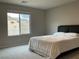 Bedroom featuring a view of distant mountains providing ample natural light at 4243 Sago Lily St, Las Vegas, NV 89129