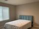 Neutral bedroom featuring a single bed and a bright window with blinds at 4243 Sago Lily St, Las Vegas, NV 89129