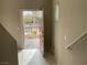 Home's entryway featuring a vibrant red door and brick-paved walkway at 4243 Sago Lily St, Las Vegas, NV 89129