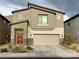 Two-story home featuring a modern design, neutral color palette, and a well-manicured front yard at 4243 Sago Lily St, Las Vegas, NV 89129