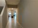 Hallway with tile flooring leading to the kitchen with stainless steel appliances at 4243 Sago Lily St, Las Vegas, NV 89129