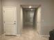 Neutral hallway featuring tile flooring, fresh paint and a bright entry at 4243 Sago Lily St, Las Vegas, NV 89129