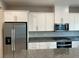 Spacious kitchen featuring a stainless steel refrigerator and granite countertops at 4243 Sago Lily St, Las Vegas, NV 89129