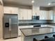 Kitchen showcasing stainless steel appliances, granite countertops, and an open design at 4243 Sago Lily St, Las Vegas, NV 89129